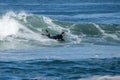 Bodyboarder surfing ocean wave