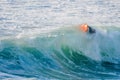 Bodyboarder surfing ocean wave