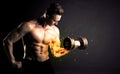 Bodybuilder athlete lifting weight with fire explode arm concept Royalty Free Stock Photo