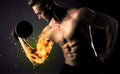 Bodybuilder athlete lifting weight with fire explode arm concept Royalty Free Stock Photo