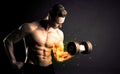 Bodybuilder athlete lifting weight with fire explode arm concept Royalty Free Stock Photo