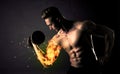 Bodybuilder athlete lifting weight with fire explode arm concept Royalty Free Stock Photo