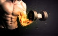 Bodybuilder athlete lifting weight with fire explode arm concept