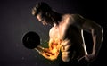 Bodybuilder athlete lifting weight with fire explode arm concept Royalty Free Stock Photo