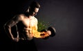 Bodybuilder athlete lifting weight with fire explode arm concept Royalty Free Stock Photo