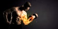 Bodybuilder athlete lifting weight with fire explode arm concept Royalty Free Stock Photo