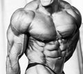 Bodybuilder athlete torso. Black and white photo