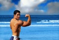 Bodybuilder on the beach Royalty Free Stock Photo