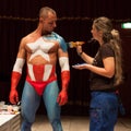 Bodybuilder during a body painting session at Milano Tattoo Convention Royalty Free Stock Photo