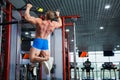 Bodybuilder doing pull-ups at modern gym. Royalty Free Stock Photo