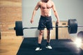 Bodybuilder drops heavy barbell weights during training