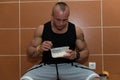 Bodybuilder Eating Healthy Diet Food Out Of Tupperware