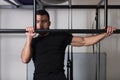 Bodybuilder Exercising Back Typewriter Pull Ups in Gym Royalty Free Stock Photo