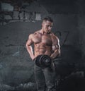 Bodybuilder on grunge wall Royalty Free Stock Photo