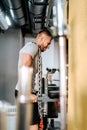 Bodybuilder handsome strong athletic man working triceps and biceps muscles with iron chain around neck. workout fitness and Royalty Free Stock Photo