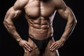 Bodybuilder man with perfect abs, shoulders,biceps, triceps and chest.