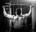 Strong man pulling a vertical upper block