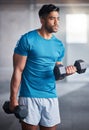 Bodybuilder man, workout and weightlifting with dumbbell in gym for healthy body, fitness and muscle. Athlete, training Royalty Free Stock Photo