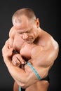 Bodybuilder measures size of biceps