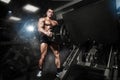 Bodybuilder muscle Athlete training with weight in gym