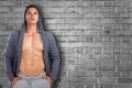 Bodybuilder muscular young man hoodie copyspace looking up think