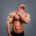 Bodybuilder neck pain Royalty Free Stock Photo