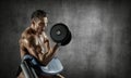 Bodybuilder perform exercise with dumbbell