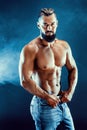 Bodybuilder posing. Beautiful sporty guy male power. Royalty Free Stock Photo