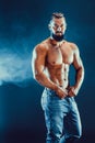 Bodybuilder posing. Beautiful sporty guy male power. Royalty Free Stock Photo