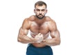 Bodybuilder posing. Beautiful sporty guy male power. Fitness muscled in blue shorts. on isolated white background. Man Royalty Free Stock Photo