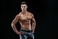 Bodybuilder posing. Beautiful sporty guy male power. Royalty Free Stock Photo