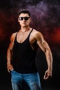 Bodybuilder posing. Beautiful sporty guy male power. Fitness muscled man in shirt. Royalty Free Stock Photo