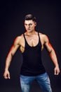 Bodybuilder posing. Beautiful sporty guy male power. Fitness muscled man in shirt. Royalty Free Stock Photo