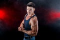 Bodybuilder posing. Beautiful sporty guy male power. Fitness muscled man in shirt. Royalty Free Stock Photo