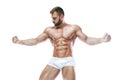 Bodybuilder posing. Beautiful sporty guy male power. Fitness muscled manin white lingerie. on isolated white background. Royalty Free Stock Photo