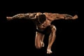 Bodybuilder posing. Beautiful sporty guy male power. Fitness muscular body. Isolated on black background