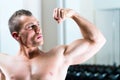 Bodybuilder posing in Gym Royalty Free Stock Photo