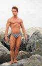 Bodybuilder posing in speedos Royalty Free Stock Photo