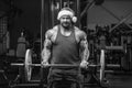 Bodybuilder in Santa Claus costume in the gym