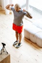 Bodybuilder showing his biceps while standing in front of camera