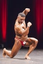 Bodybuilder shows his best physique on stage