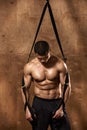 Bodybuilder with suspension rope