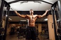 Bodybuilder Is Working On His Chest With Cable Crossover In Gym. Royalty Free Stock Photo