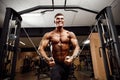 Bodybuilder Is Working On His Chest With Cable Crossover In Gym. Royalty Free Stock Photo