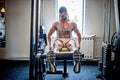 Bodybuilder working out and training at the gym, legs and feet