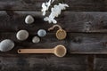 Bodycare concept with pebbles, wooden back brush and white orchids