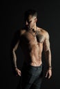 Bodycare with fitness and sport. Man with tattooed arm and chest. Bearded man with strong torso. Tattoo model with sexy