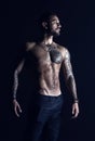 Bodycare with fitness and sport. Tattooed man show sexy muscular torso. Sportsman with six pack and ab. Bodybuilder with