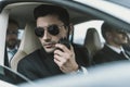 bodyguard in sunglasses talking by portable Royalty Free Stock Photo