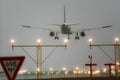 Boeing 767 landing with runway lights on. Royalty Free Stock Photo